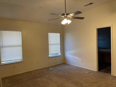 Spare room with carpet and ceiling fan