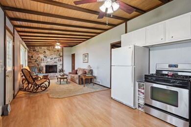 As you travel through the home, you will notice beautiful wood ceilings that add to the overall ambiance. The natural color of the wood brightens up the room and offers a warm and relaxing atmosphere.