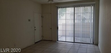 Living room featuring light tile patterned floors