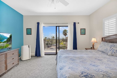 Bedroom with light carpet, access to exterior, and ceiling fan