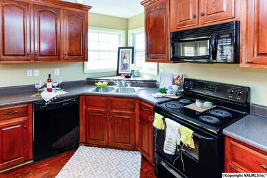 Well-appointed kitchen.  Enjoy cooking meals while gazing out the large windows.  Spill on the floor? No worries! The vinyl plank flooring can be cleaned up without special cleaners or fear of warping with laminate or hardwood.