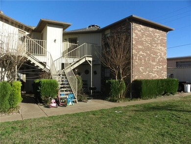 Rear view of house with a yard