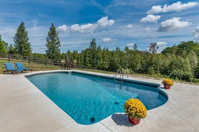Gorgeous pool area overlooks the back yard.  Home 