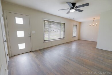 OPEN LIVING AND ENTRY AREA WITH A COAT CLOSET, NEW
