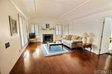 Living room, boasting 10 foot ceiling, fireplace, 