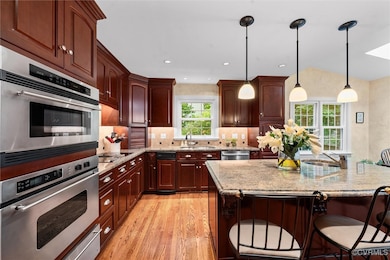 Kitchen with a sink, light wood-type flooring, a k