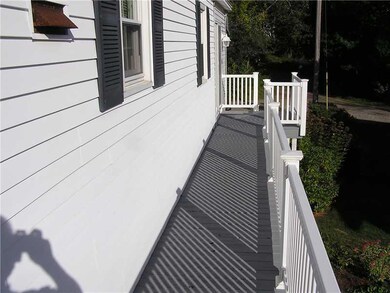 Exterior Front. Side view with small...