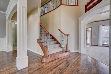 Sweeping staircase greets you in the entry!