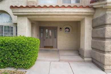 Property entrance featuring stucco siding