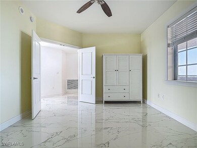Unfurnished bedroom featuring light marble finish