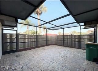 View of patio featuring a sunroom