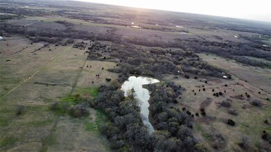 Aerial view with a water view and a rural view