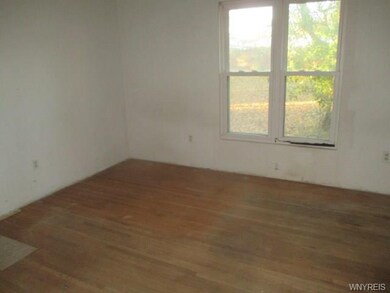 BEDROOM WITH HARDWOOD FLOORS