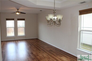LIVING AREA WITH LOTS OF NATURAL LIGHT