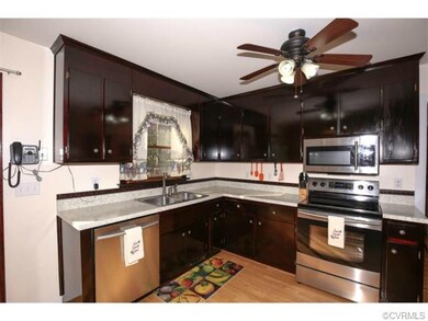 New stainless steel appliances, wood laminate floo