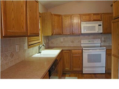 Notice the beautiful backsplash in the kitchen