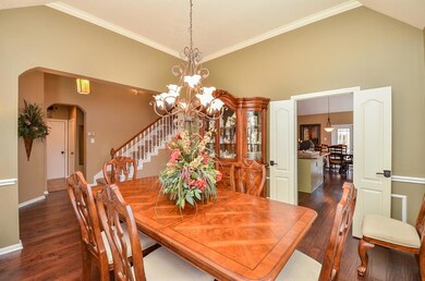 Crown molding and chair railing accent the large formal dining area.  Perfect for large family gatherings.