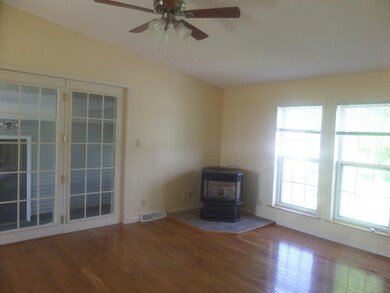 familyroom with pellet stove off the...