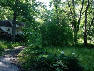 Exterior Front. VIEW FROM THE DRIVEWAY