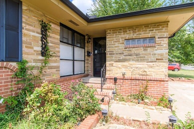 Entrance to property with brick siding