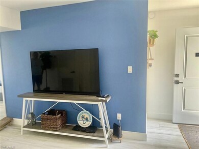 Room details featuring baseboards and wood finished floors