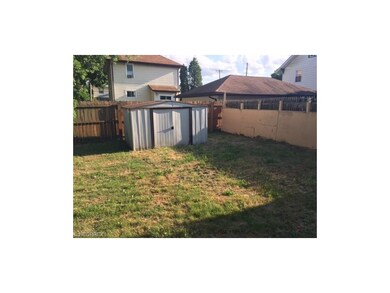 Fully Fenced in back yard with store shed