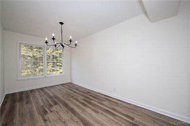 Dining room featuring durable LVP flooring and a n