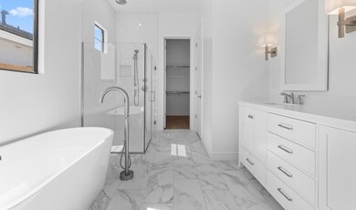 Primary bath with glass shower enclosure