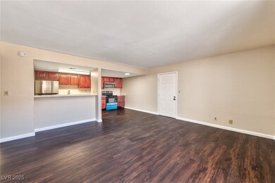 Unfurnished living room with dark wood-style floor