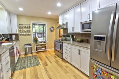 Looking from the dining room into the kitchen