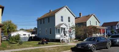 View of front of property with a front lawn