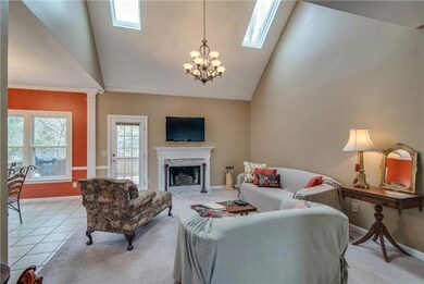 Living room with fireplace and lots of natural light