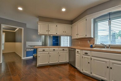 Kitchen cabinetry with  bar and breakfast nook beh