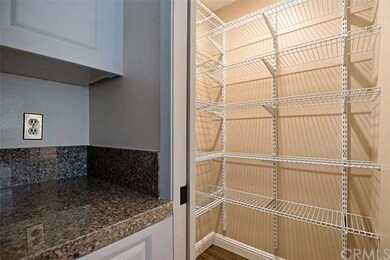 Ample shelving in lighted walk in pantry. Easy to 