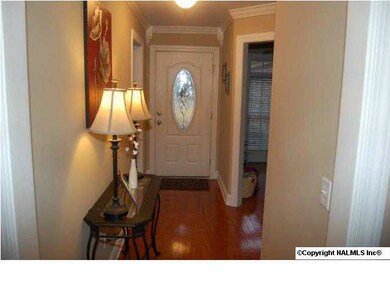View of the front door entrance. You can see the study to the right.
