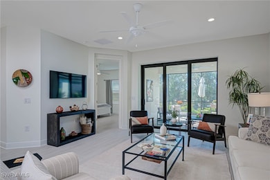 Living area with recessed lighting, visible vents,