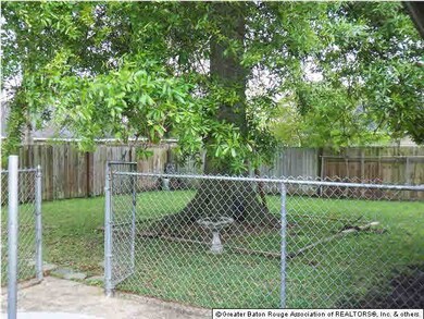 Fenced rear lawn.