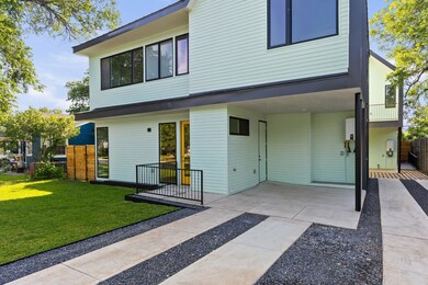Back of house with a carport