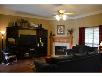 Living Room. Spacious living room with crown molding and gas fireplace.