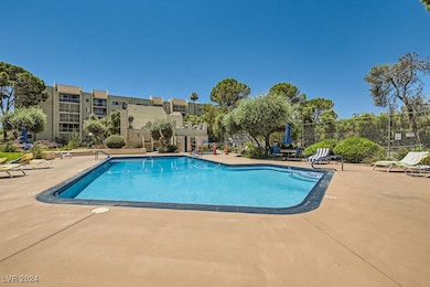 Community pool featuring a patio area
