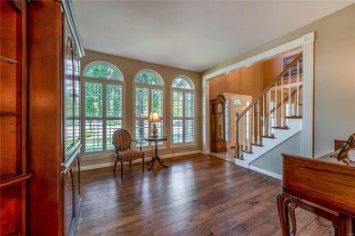 Living Room/Office with Beautiful Arched Windows