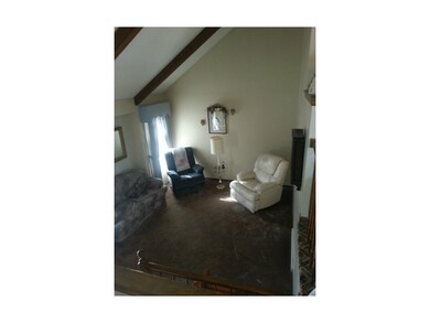 Living room with vaulted ceiling
