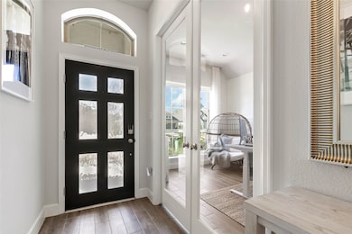 Inviting foyer entry with eye catching arched pass