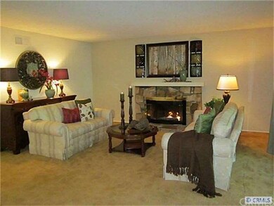Living room with crackling fireplace.