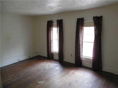 Master Bedroom. Refinish the hardwood floors or ad