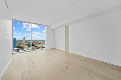 Spare room with floor to ceiling windows, wood-ty