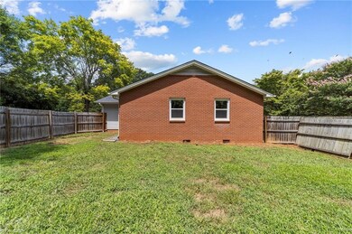 FENCED YARD AND REAR OF HOME