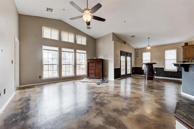 Living room featuring high vaulted ceiling and cei