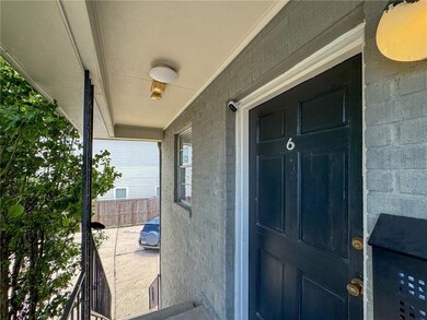The front door, facing parking