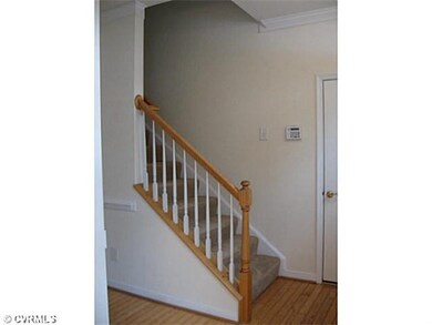 Foyer - Foyer with front staircase and wood floori